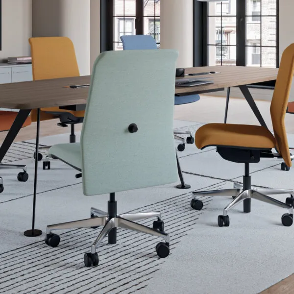 Colourful Deva meeting room chairs around a table