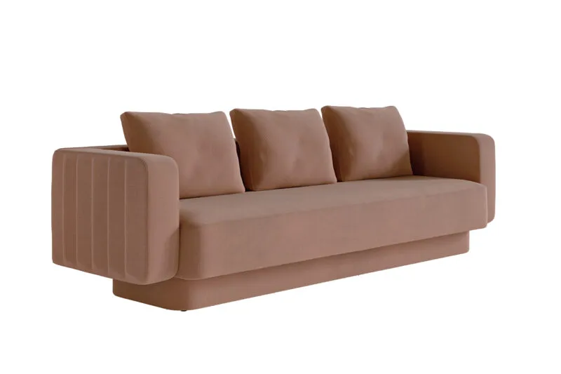 Canapé designer luxe Sabree trois places en tissu terracotta, vue trois-quarts révélant les proportions monolithiques et les flancs sculptés — design italien