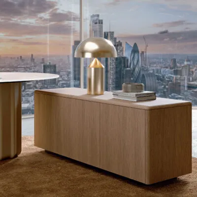 Sabree design sideboard in oak finish with brass accessories and panoramic city skyline view — Italian contemporary design