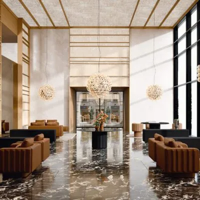 leather waiting room sofas and armchairs in a contemporary hospitality lounge with marble flooring