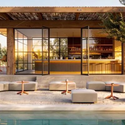 Restaurant patio with modular ottomans and Frezza tables by the pool