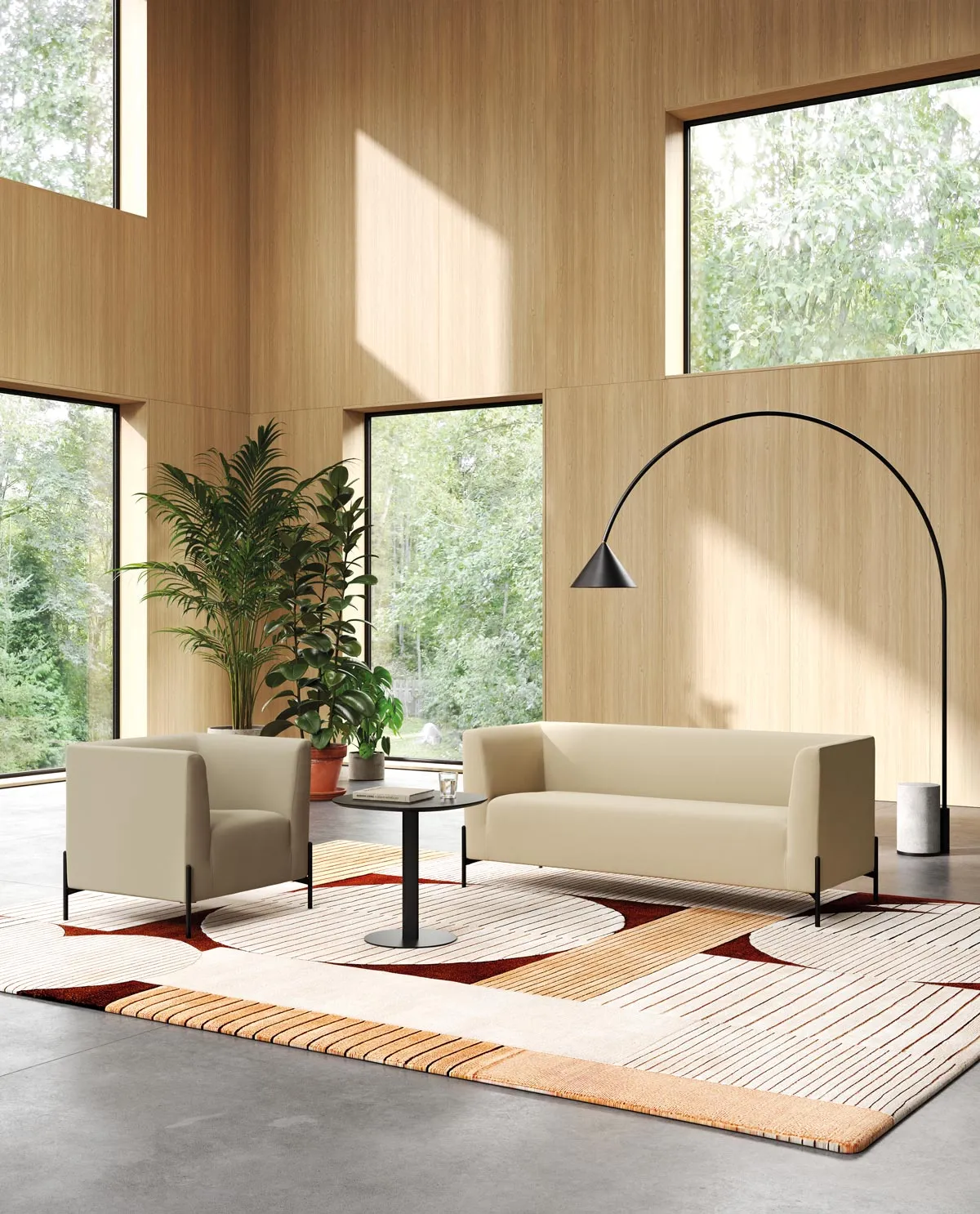 Clint beige fabric armchair and three-seater sofa for office waiting areas, in a double-height space with wooden walls and large windows