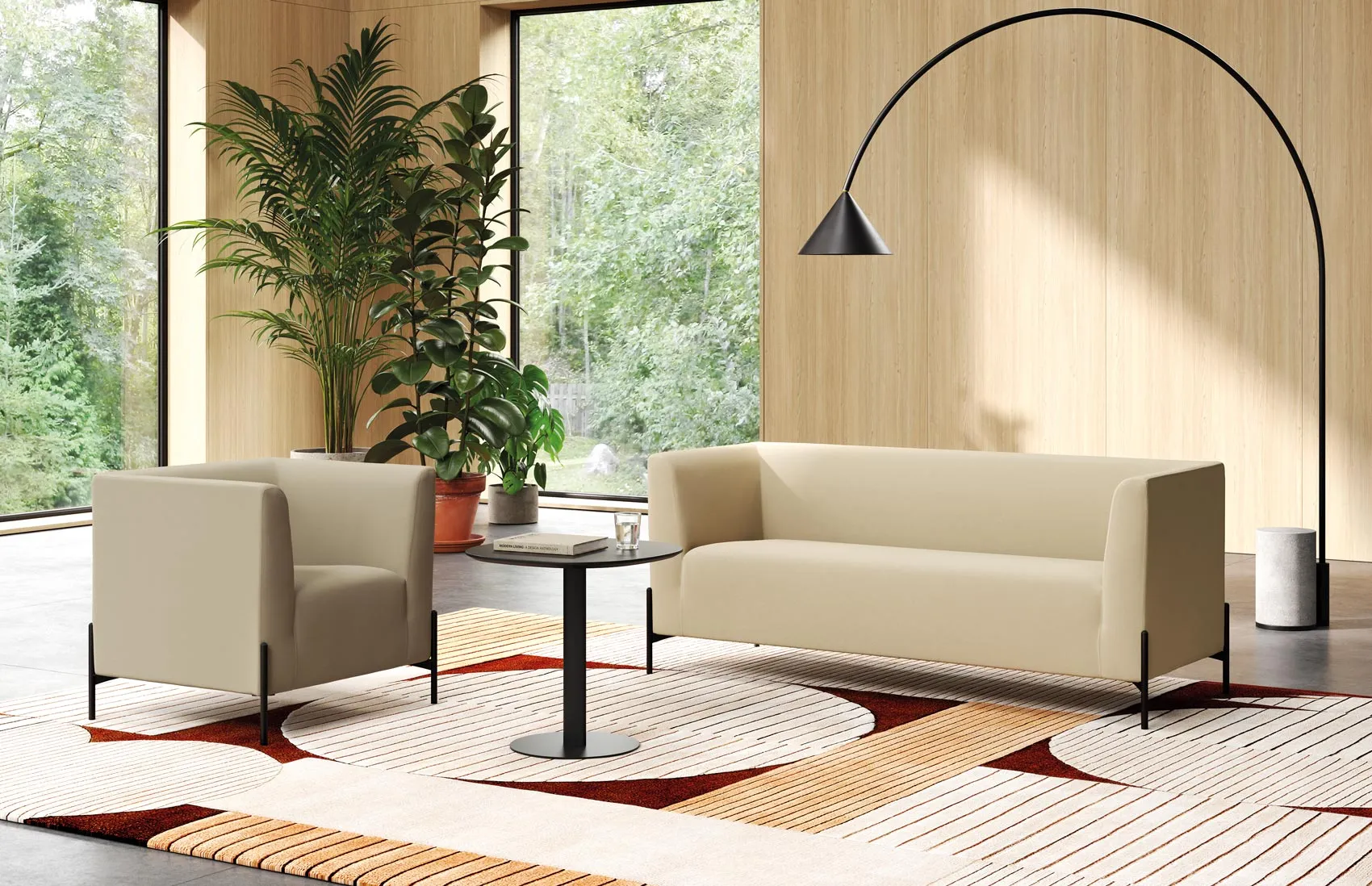 Clint waiting room seating: beige fabric armchair and three-seater sofa on black steel feet, in a lounge with wooden walls